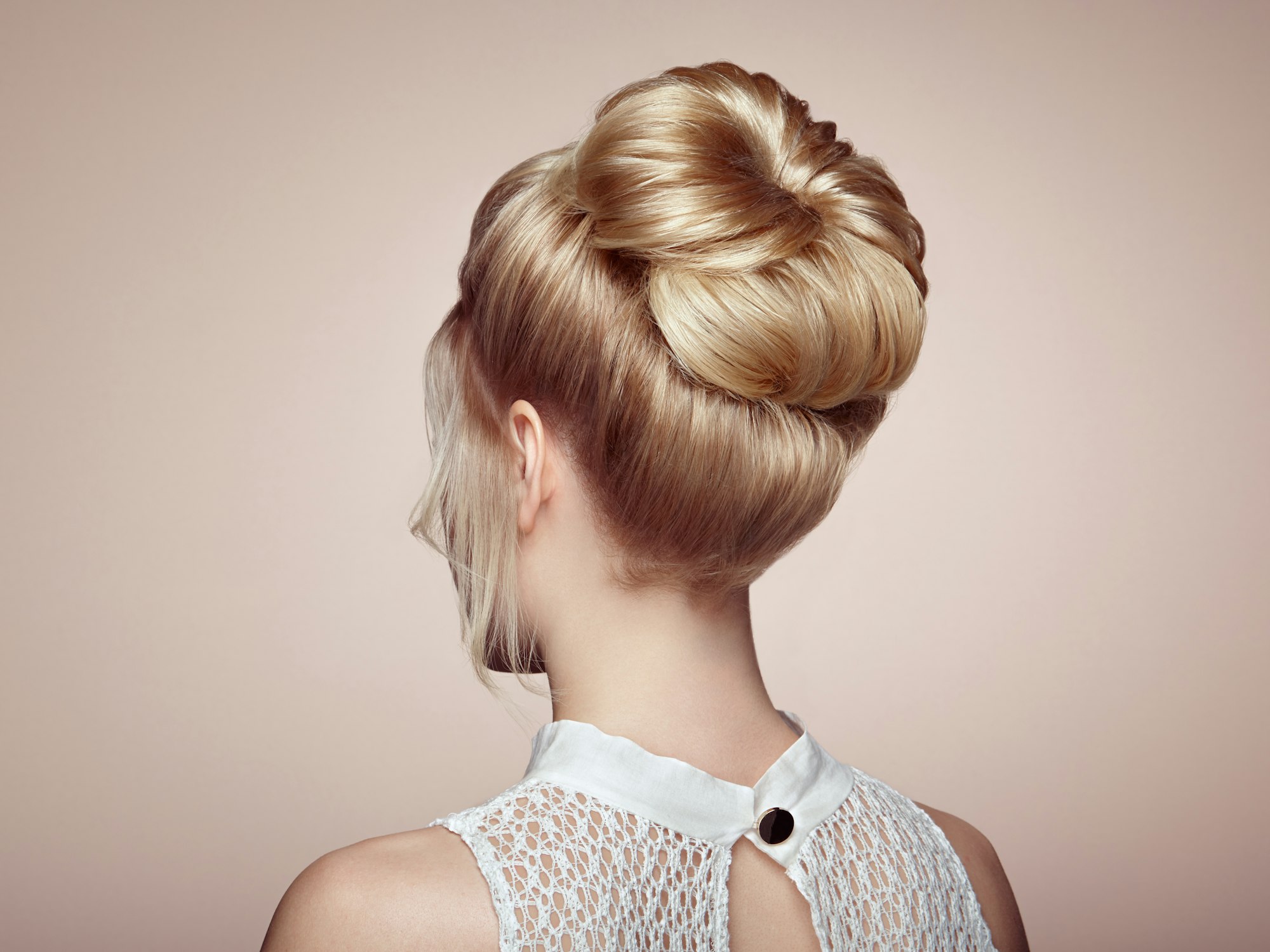 Blonde girl with elegant and shiny hairstyle